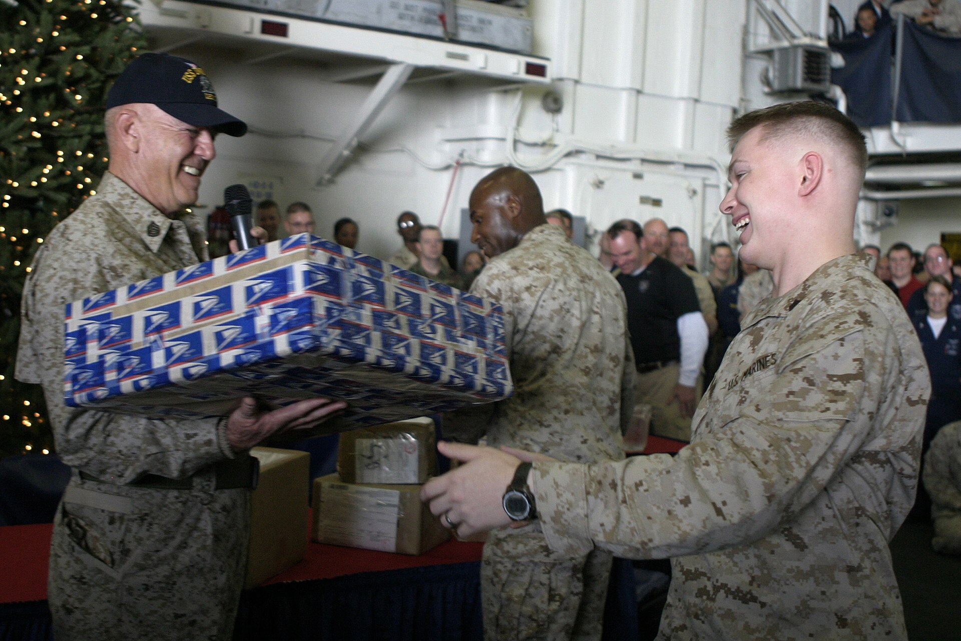 R. Lee Ermey with troops at Christmas — delivering packages, laughing