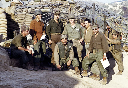 U.S. Army soldiers gathered at a sandbagged bunker position in Korea — the kind of fortified outpost position defended at Outpost Harry